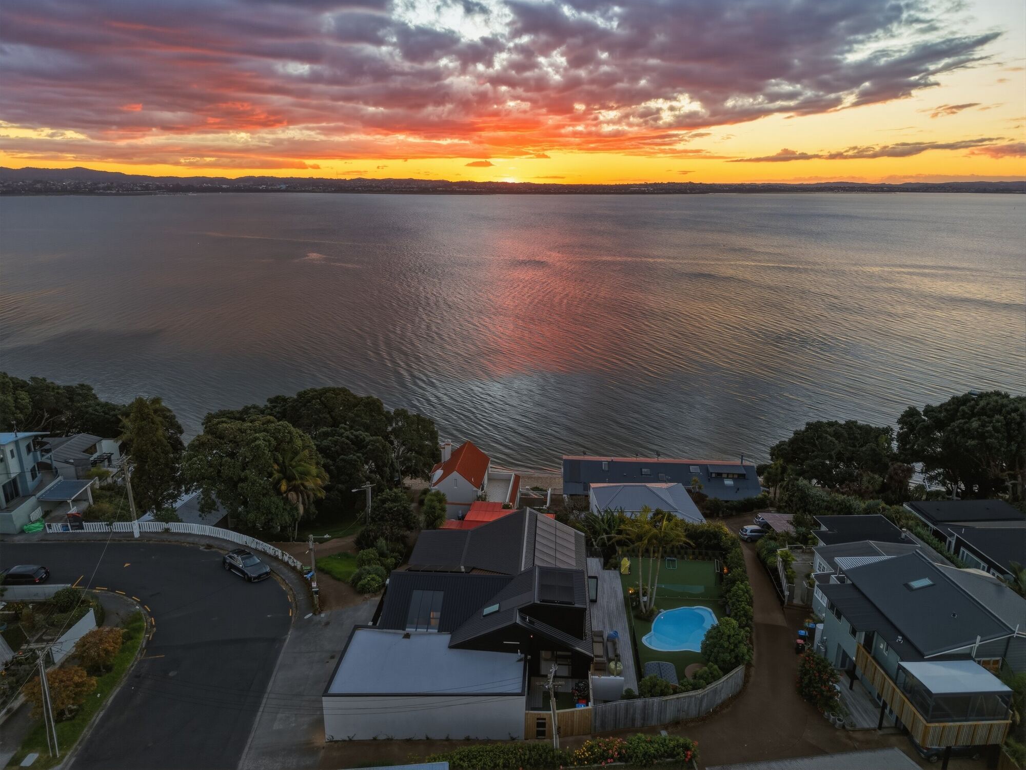 Coastal Auckland property at sunset